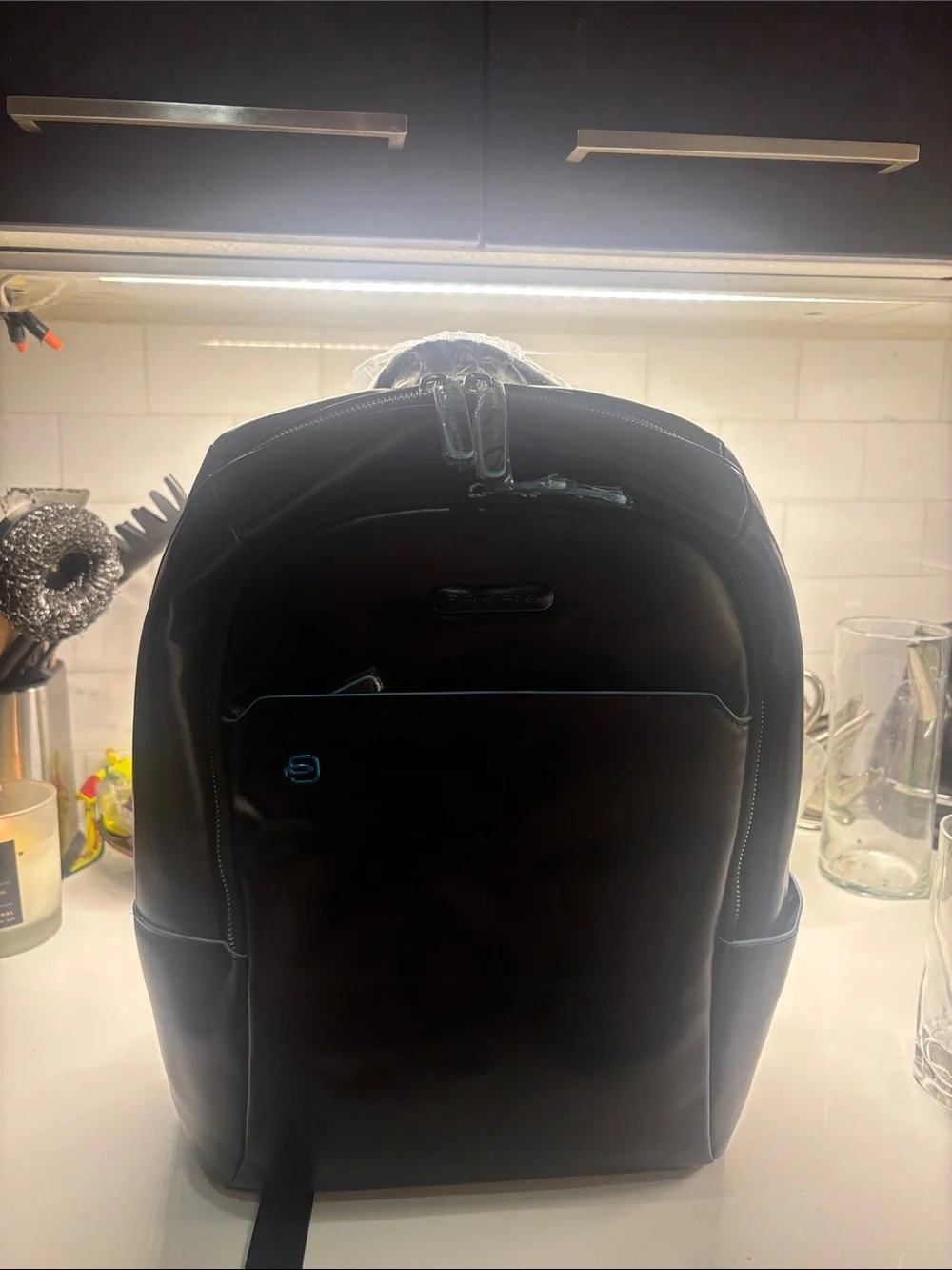 Piquadro Leather Backpack with Blue Trim